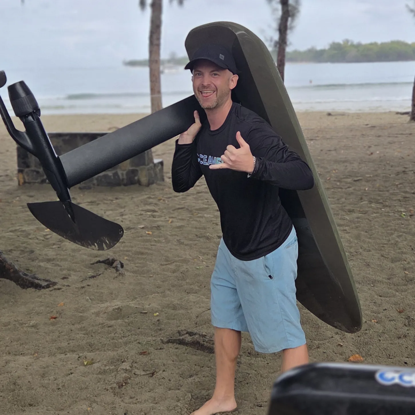 Jan Nagel carrying an eFoil in Mauritius